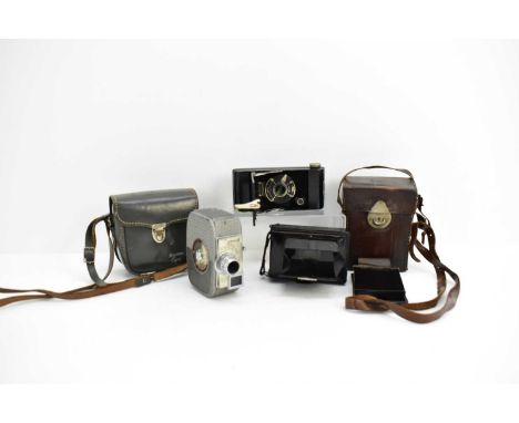 Three vintage cameras, comprising a Coronet field camera, a Compur Jos. Schneider &amp; Co folding camera and plates, in leat