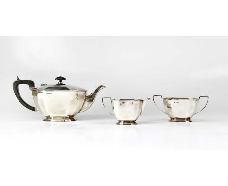 COOPER BROS &amp; SONS LTD; George VI Art Deco hallmarked silver three-piece tea service, comprising teapot with ebony knop a