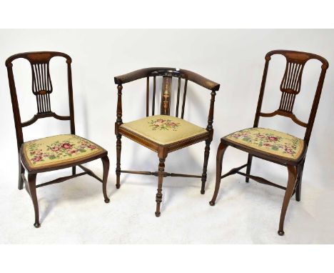 An Edwardian inlaid mahogany corner open armchair with tapestry seat, on turned slender legs, together with two Edwardian inl