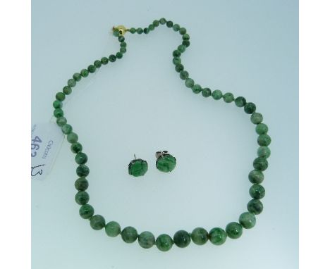 A graduated jade bead Necklace, with a 9ct yellow gold ball shaped snap, marked 375, 66 beads in total, 20in (51cm) long toge