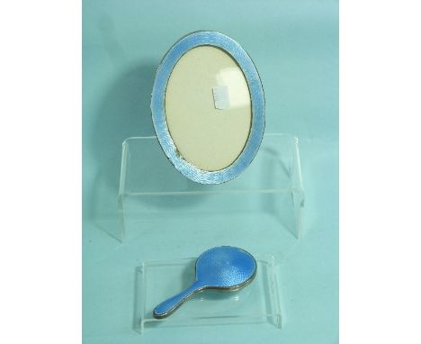 A George V silver and Tortoiseshell mounted Hand Mirror, by Adie Brothers Ltd., hallmarked Birmingham, 1922, with plain front