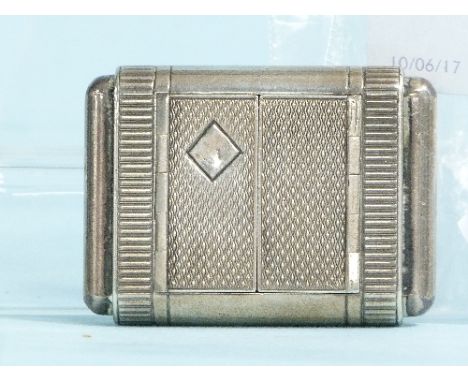 A Swiss silver Travel Clock, by Tavannes Watch Co., numbered 825925, of oblong form with engine turned decoration, the sides 