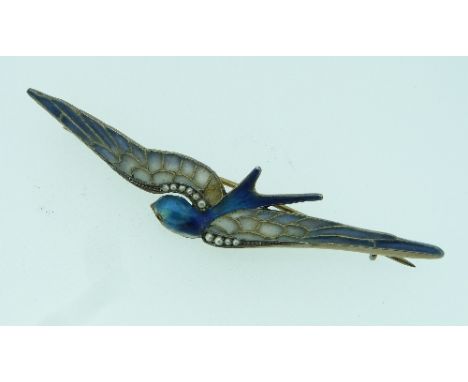 An attractive Brooch, in the form of a swallow, the body in blue and white enamel with red stone eye, the wings with plique-a