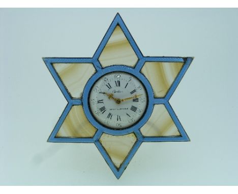 An early 20thC silver gilt and enamel easel Desk Clock by Cartier, in the form of a six point star, the blue guilloche enamel