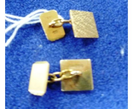 A pair of gold Cufflinks,  made from two pairs, with chain between, the square front with textured 9ct yellow gold, the oblon