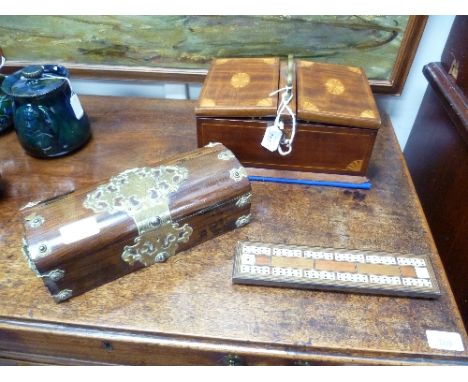 An Edwardian mahogany Games Box, with fan inlays, the base stamped "W.H.B.& S. London", of rectangular form with brass carry 