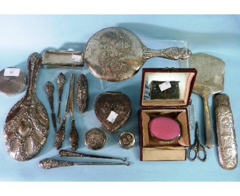 A George V silver backed Hand Mirror, by Adie Brother ltd., hallmarked Birmingham 1934, together with two other silver backed