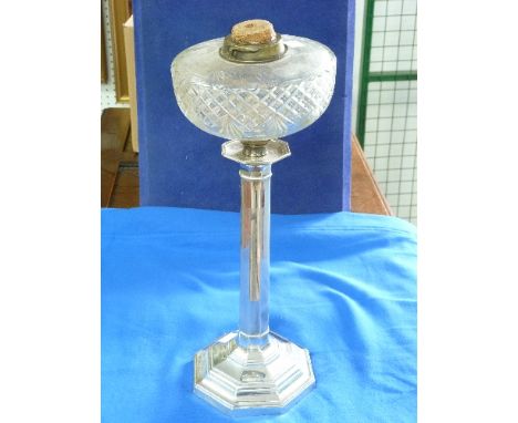 A George V silver Column Oil Lamp, by Hawksworth, Eyre & Co. Ltd., hallmarked Sheffield, 1915, the stepped Octagonal base wit