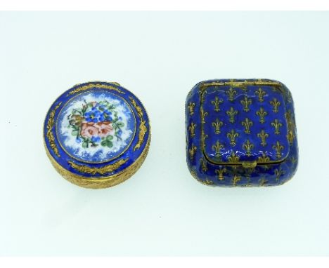Two Enamel Boxes, in gilt metal , one with bouquet of flowers in lid, the other Fluer-de-lys (2)
