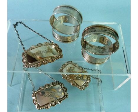 A pair of silver Wine Labels, hallmarked London, 1969/1970, of rectangular form with shell and foliate border, the centres in