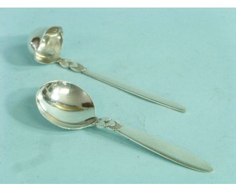 A Georg Jensen silver 'Cactus' pattern Cream Ladle, London import marks for 1931, 5in (13cm) long, together with a Georg Jens
