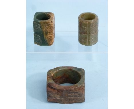 A Chinese mottled green and brown jade archaic style Cong, each corner with the same carving detail, 1½in (4cm) high, togethe