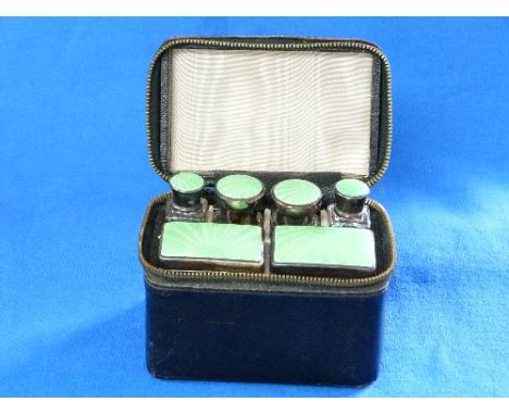 An cased early 20thC guilloche enamel mounted glass six bottle/box Vanity Set, comprising two scent bottles, two smaller bott
