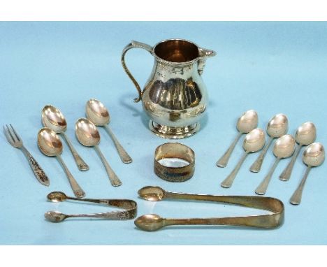 A George V silver Cream Jug, by Edward Barnard & Sons Ltd., hallmarked London, 1928, of plain baluster form with scroll handl
