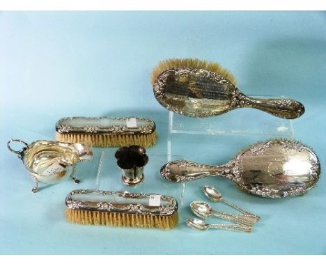 A set of four George V silver backed Brushes, by W.J. Myatt & Co., hallmarked Birmingham, 1914, the silver chased with a scro