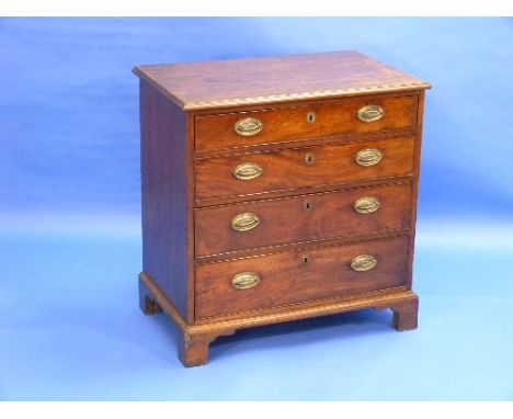 A George III mahogany Batchelors Chest of Drawers, with four graduating long drawers raised on bracket feet, 30½in (78cm) wid
