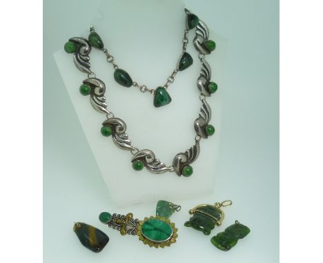 A Mexican silver Necklace, formed of eleven bird shaped links, each set with cabochon green stone, together with another silv