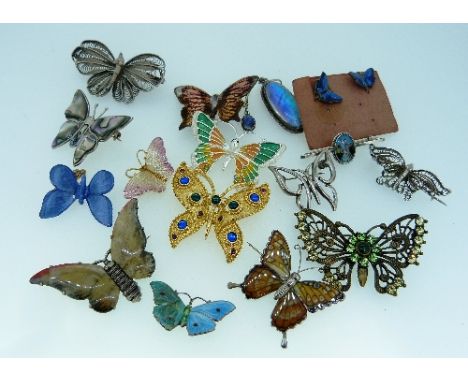 A collection of Butterfly Brooches and Earrings, comprising five brooches with enamel wings, two with plastic wings, two in w