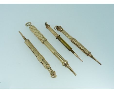 A yellow metal propelling pencil / pen combination, with engine tuned decoration, suspension loop, 4½in (11.5cm) when extende