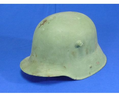 A W.W.2 style German Steel Helmet, repainted, lacks lining, etc. 