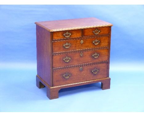 A George III mahogany Batchelors Chest of Drawers, with two short, above three long graduating drawers raised on bracket feet