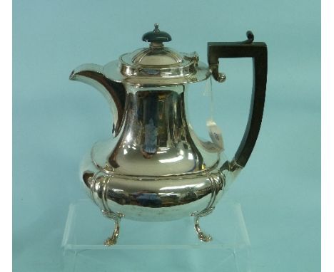 A George V silver Coffee Pot, by James Deakin & Sons, hallmarked Sheffield, 1931, of plain oval baluster form, with ebonised 