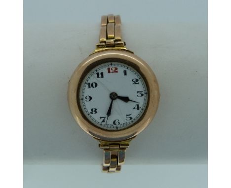 A 9ct gold lady's Wristwatch, with circular dial and 9ct gold expanding gate-link bracelet.