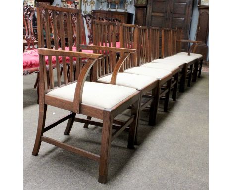 A Set of Eight 1930s Oak Dining Chairs, the two carvers stamped Foster &amp; Son, the six single chairs stamped R Tyzack (8)