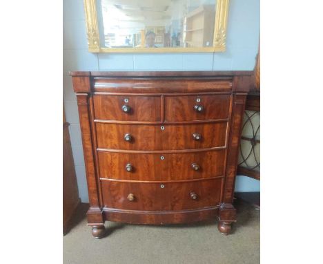 A Victorian Mahogany Bow Fronted Scotch Chest, with mother of pearl escutcheons and rosewood handles, 124cm by 59cm by 140cmB
