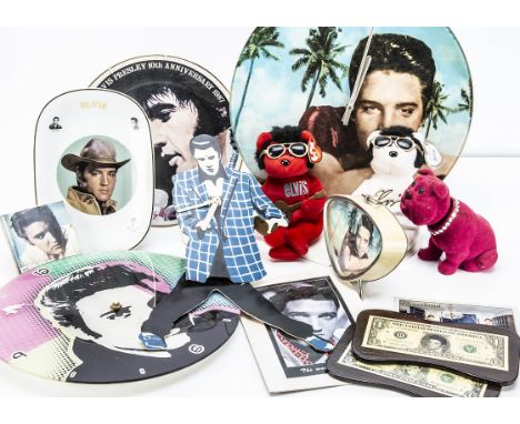 Elvis Presley Memorabilia, a large collection of Elvis memorabilia that includes glass image paper weights, coasters, bottle 