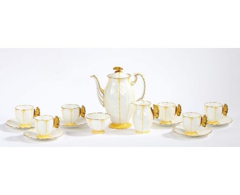 An Aynsley Art Deco butterfly and leaf moulded coffee set, pattern B1322, the handles modelled as butterflies, consisting of 