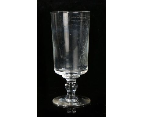 Attributed to Laurence Whistler CBE (1912-2000)A tapered cylindrical glass on bulbous stem to footed base, etched with view o