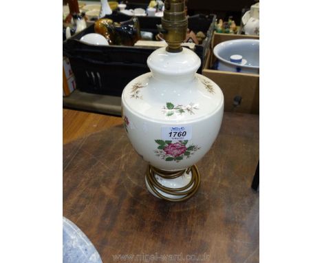 A Wedgwood table lamp with floral and butterfly decoration. 12 1/2" tall.