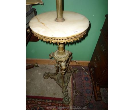 An unusual and heavy Brass pillar standard Lamp, adjustable for height and having a circular marble shelf, the base with orna