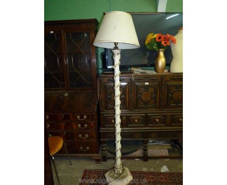 A cream and gold painted, hand-made Standard Lamp decorated with a spiral rope terminating in flared tassels to the base and 