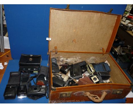A leather suitcase (a/f) and contents including various compact cameras, Olympus Trip MD, etc. together with an Olympus T20 c