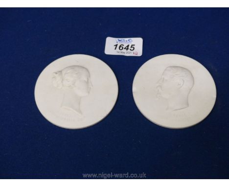 A pair of mid 19th century Sevres biscuit portrait plaques, Napoleon III and the Empress Eugenie, modelled by Jules Constant 