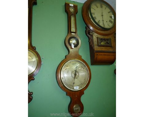 A Mahogany cased five point Barometer with hydrometer, thermometer Convex Mirror, barometer and level, bears label "John E. J