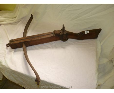 An old continental wood and iron crossbow.