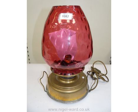 A Victorian Church oil/heater Lamp with squat brass fount, complete with handles, on three squat feet, with brass gallery sup