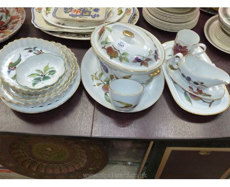 A quantity of Royal Worcester Evesham including pie dish, sauce boat and saucer, tureen, three graduated flan dishes, etc. pl