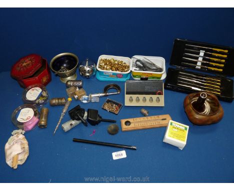 A box of miscellanea to include tweezers and pins, thermometer, pen stand, old tin of salt and pepper pots, pig money box, et