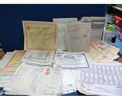 A quantity of old share certificates, conveyance documents etc.