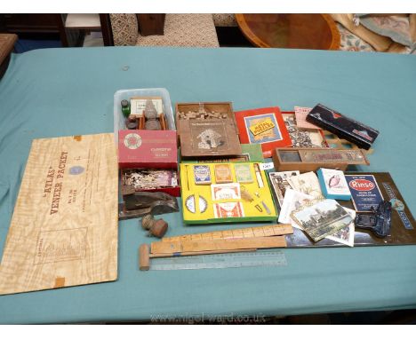 A box of miscellanea including  mapping pens and vintage games.