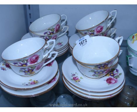 A pretty floral Royal Worcester part Teaset comprising nine cups and saucers, ten tea plates, (one cup with hairline crack an