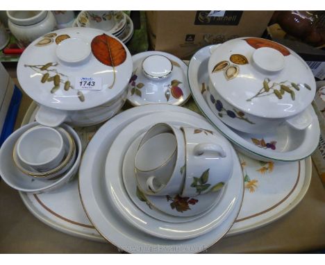 A quantity of Royal Worcester 'Evesham' including tureens, pie dishes, coffee cup and saucer, oval serving dish with chip etc