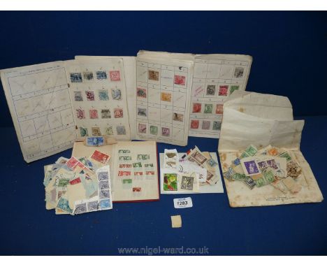 A small quantity of loose stamps including British Empire and Commonwealth games etc, small red stamp stock book and three \p