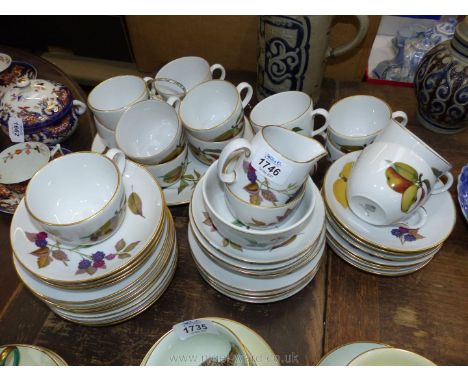 A Royal Worcester 'Evesham' part Teaset including 15 cups and saucers, two chipped, 12 tea plates, milk jug, sugar bowl, slop