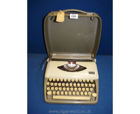 A Tippa grey cased Typewriter, 12'' x 12''