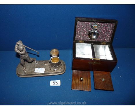 A small Rosewood Tea Caddy with brass inlay and key and a plated Inkwell in the form of a Golfer